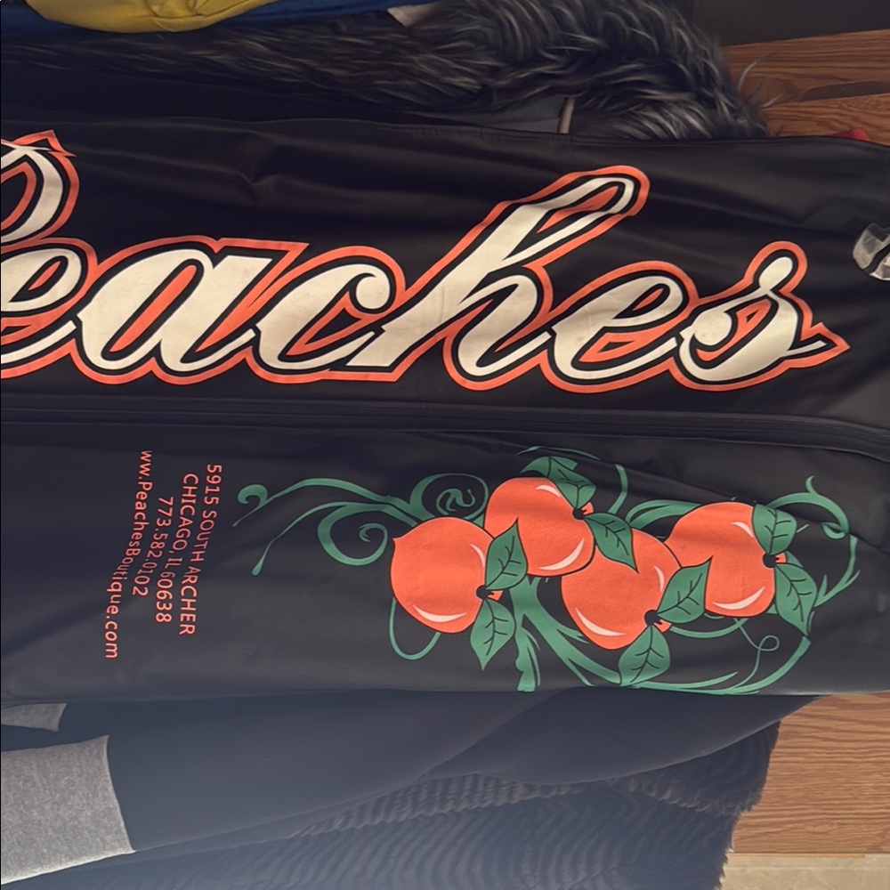 Peaches Black Jacket with Orange and Green Design. Worn once great condition.